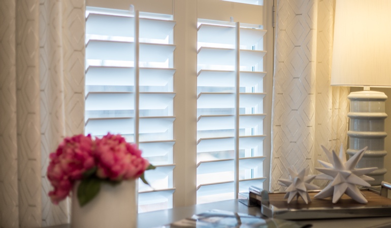 Plantation shutters by flowers in Jacksonville